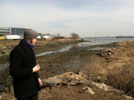 Eric Peterson, deputy City Parks administrator for Randall's Island Park, stands at the Bronx Kill, looking toward the East River.