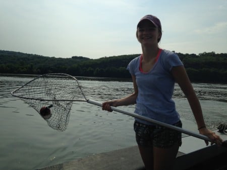 Catch of the day: Emma nets a fire extinguisher. (Photo by Dan Shapley/Riverkeeper)
