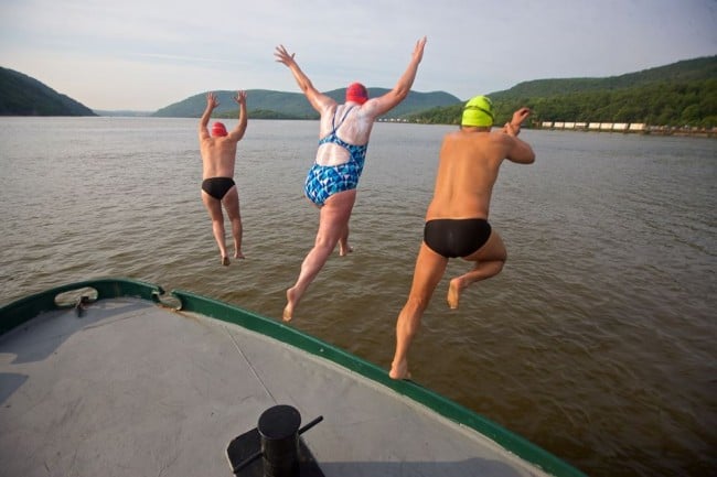 Swimmers leap into the Hudson as part of the 8 Bridges Swim. (Photo courtesy Greg Porteus/Launch 5)