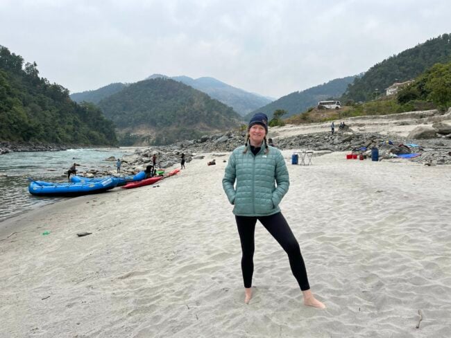Tracy Brown standing along the Karnali River