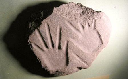 Petroglyph of hands in red sandstone, 3000-1000 years ago